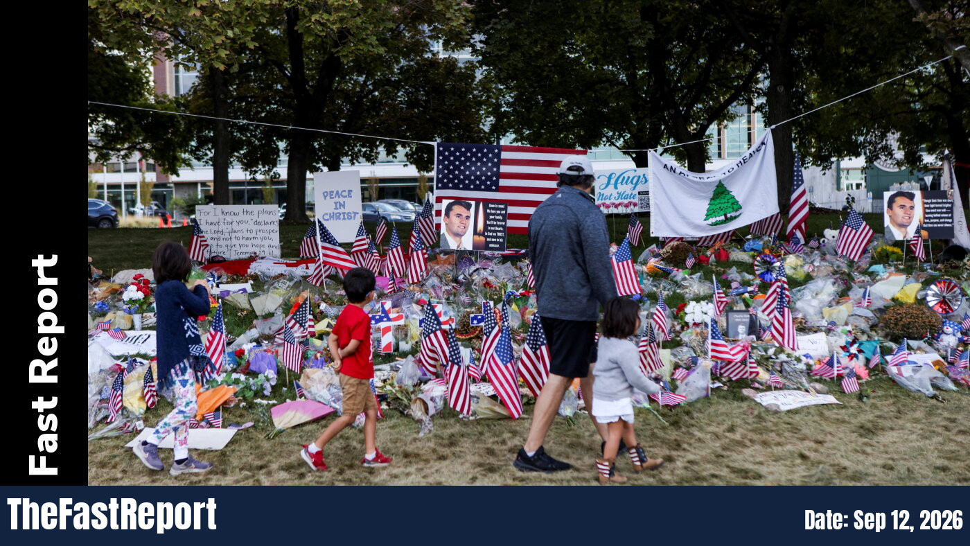 People pay their respects at a memorial for slain conservative commentator Charlie Kirk, at Utah Valley University